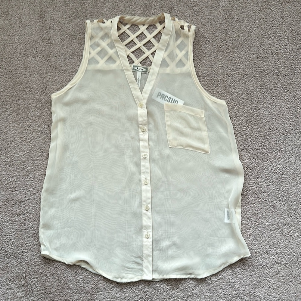 Sheer cream colored blouse.